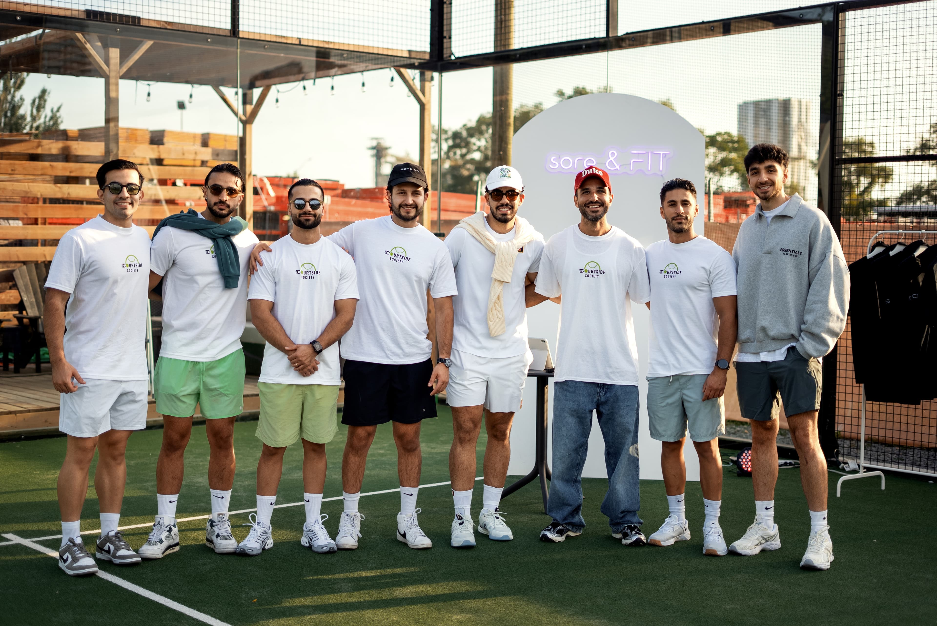 Crew in Courtside Society tees courtside at a fixture